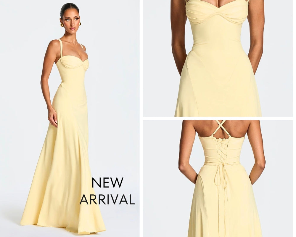 Flowing silhouette of the navy Sura Maxi Dress showing off the full skirt with integrated godets