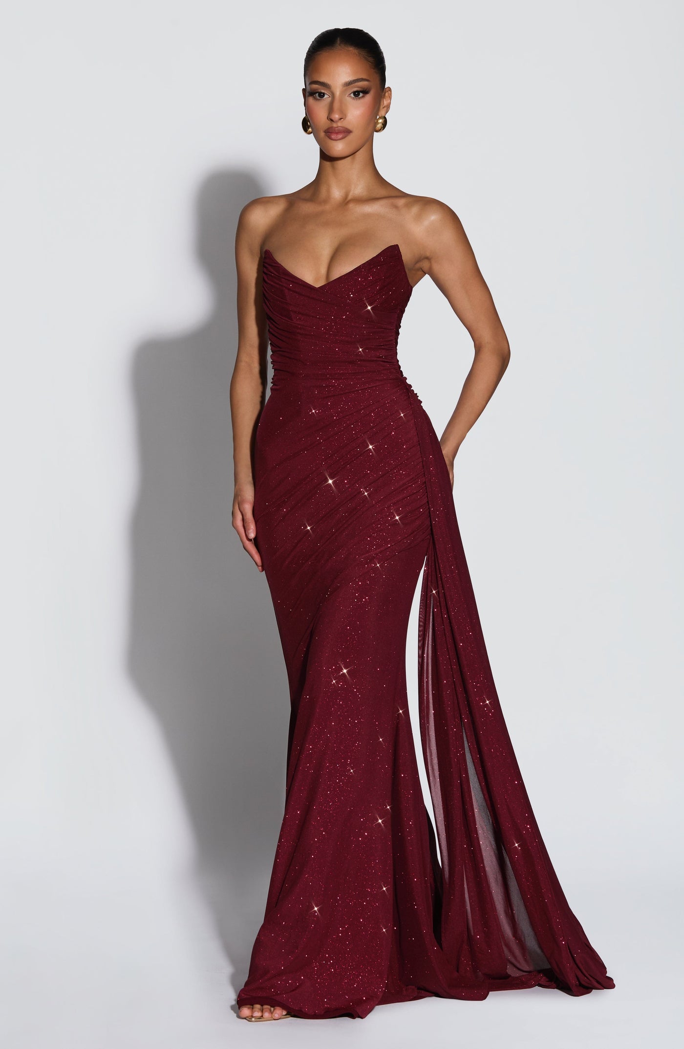 Side view of the Ashika Maxi Dress showing the flowy floor-length hemline and elegant drape