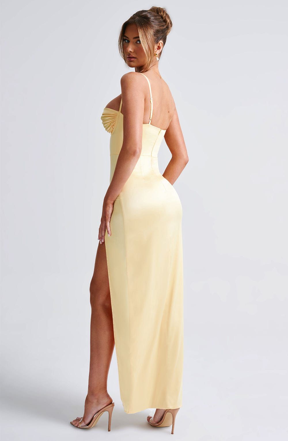 Alora maxi dress side view with thigh high slit and curve enhancing ruched design