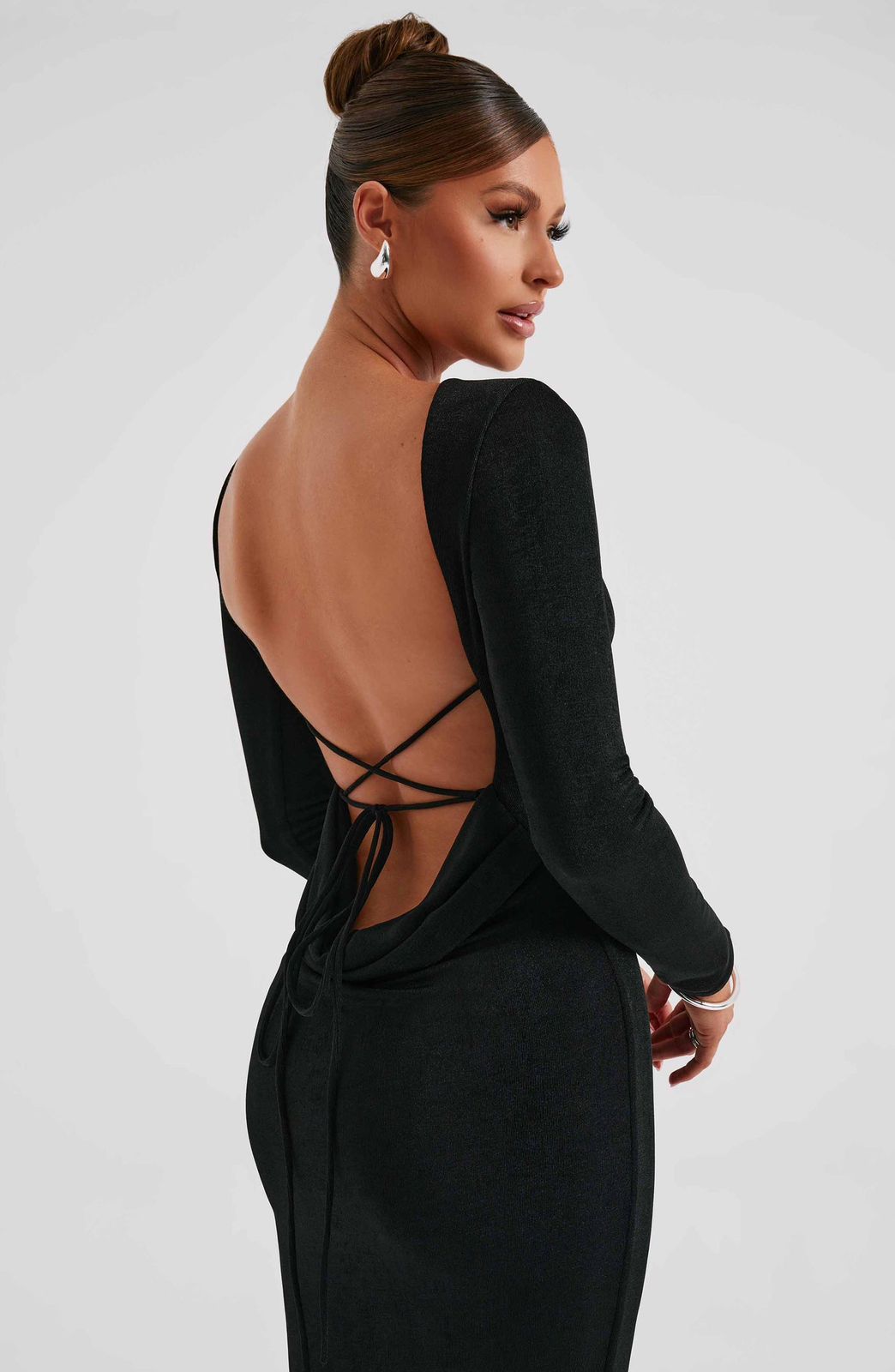 Side profile of the Anastassia Maxi Dress highlighting the premium double-layered fabric and sleek silhouette