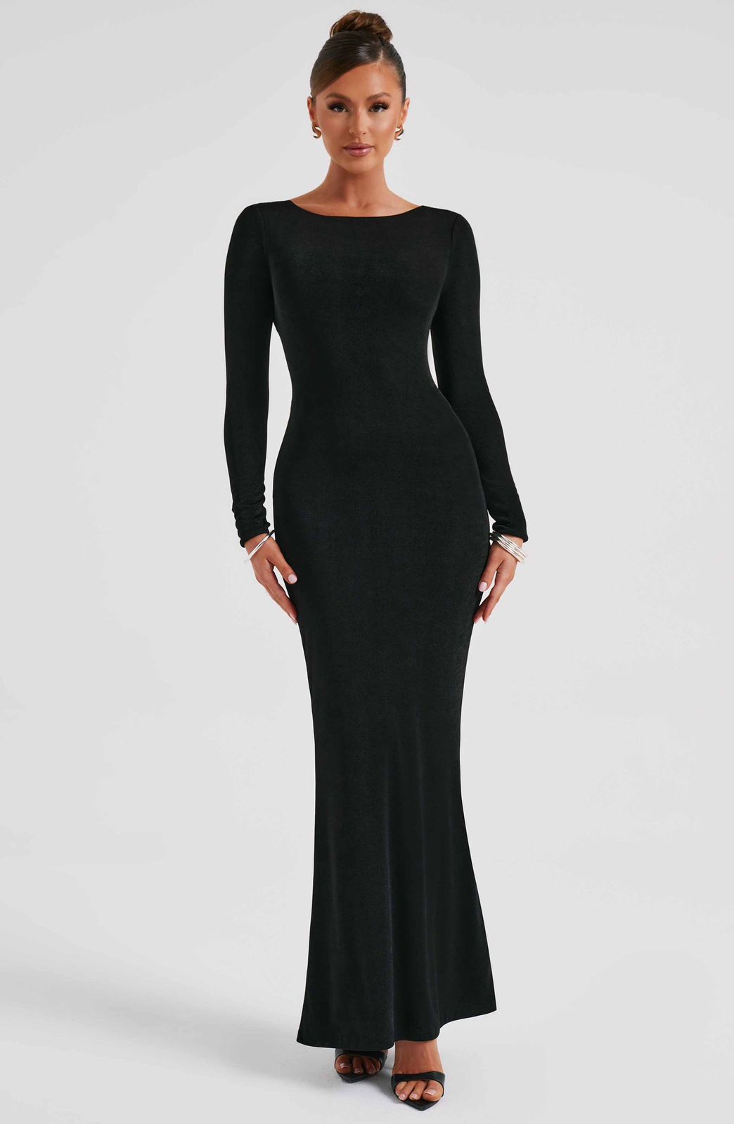 Anastassia Maxi Dress by Qorsage - Front view of a floor-length black dress with long sleeves and a body-sculpting fit