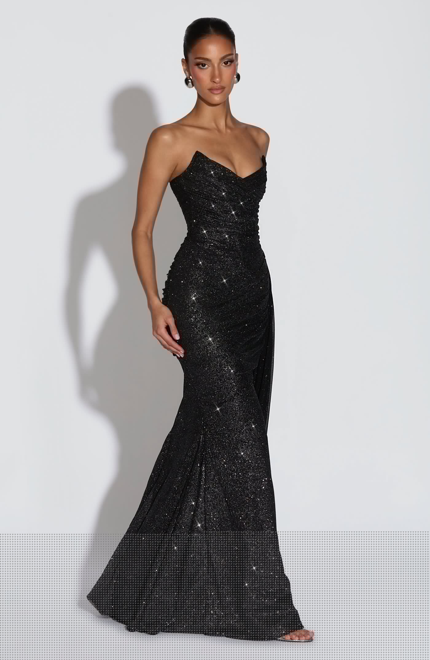 Side view of the Ashika Maxi Dress showing the flowy floor-length hemline and elegant drape.
