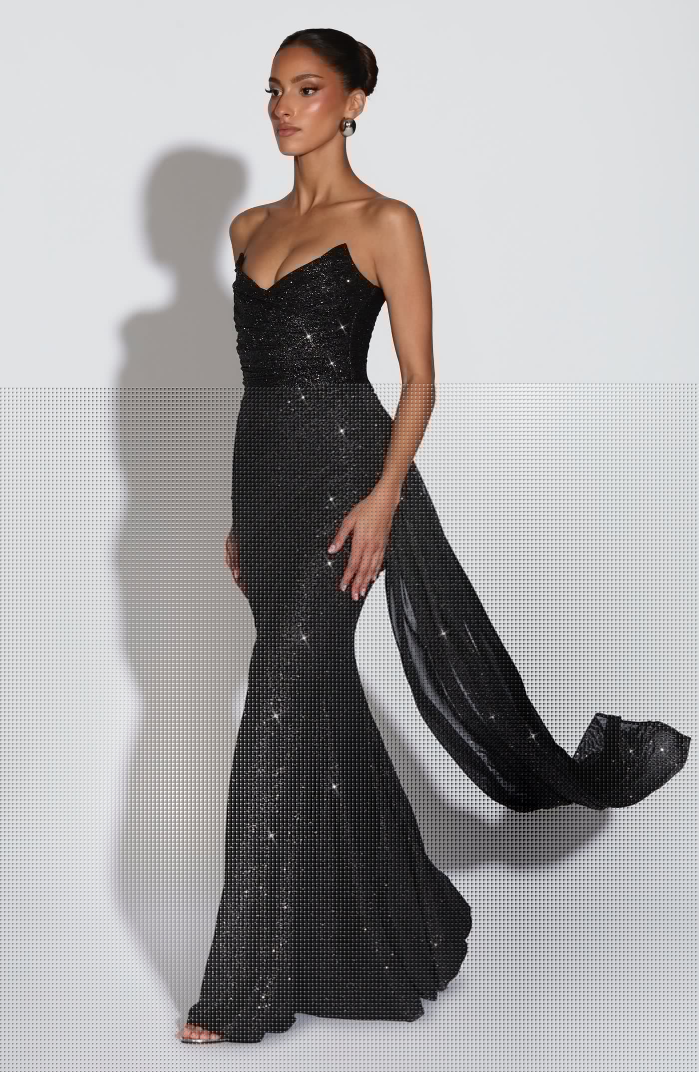 Side view of the Ashika Maxi Dress showing the flowy floor-length hemline and elegant drape.