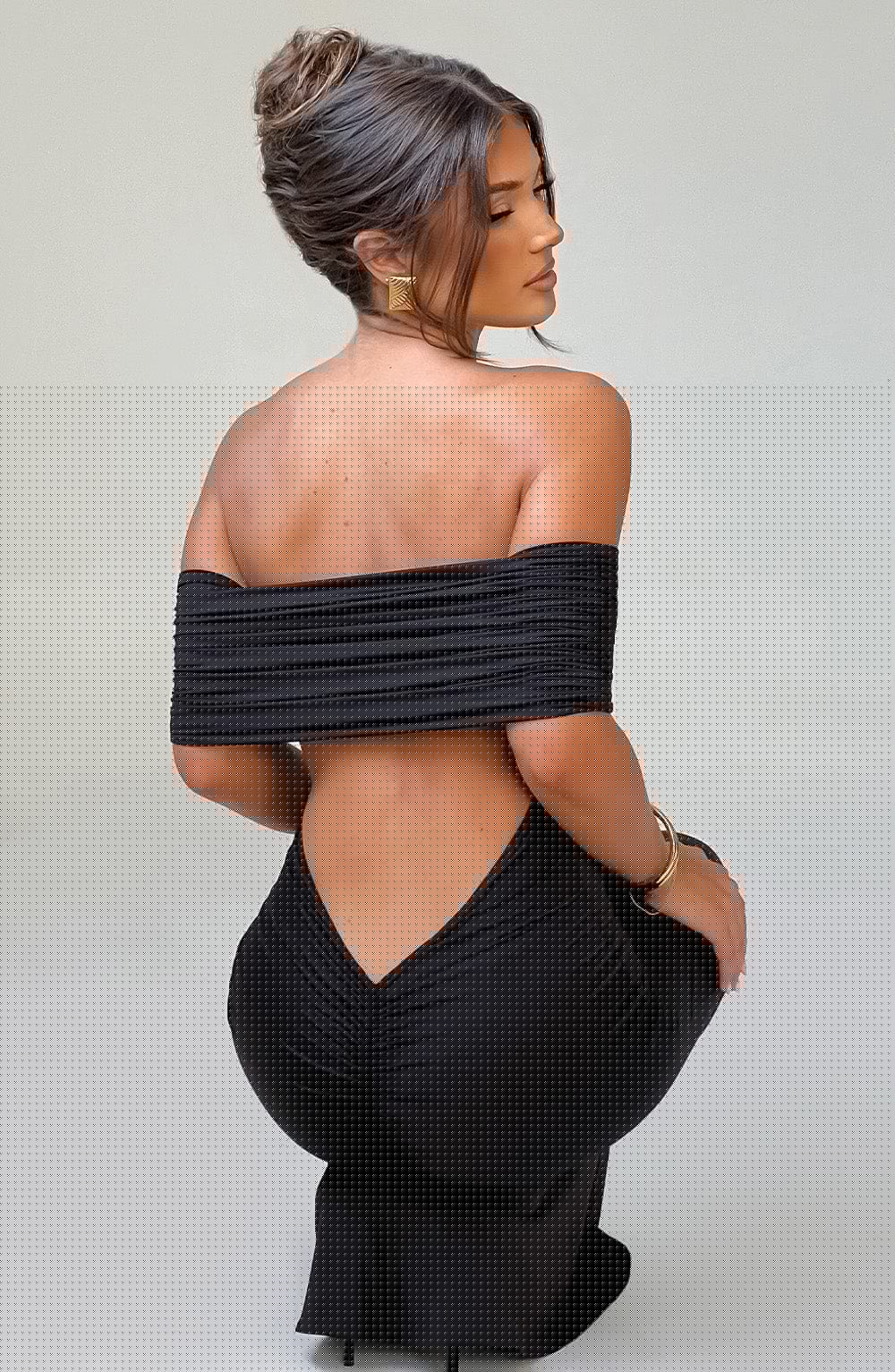 Rear view of the Belinda Maxi Dress highlighting the bold open low-cut back and figure-enhancing ruched detailing.