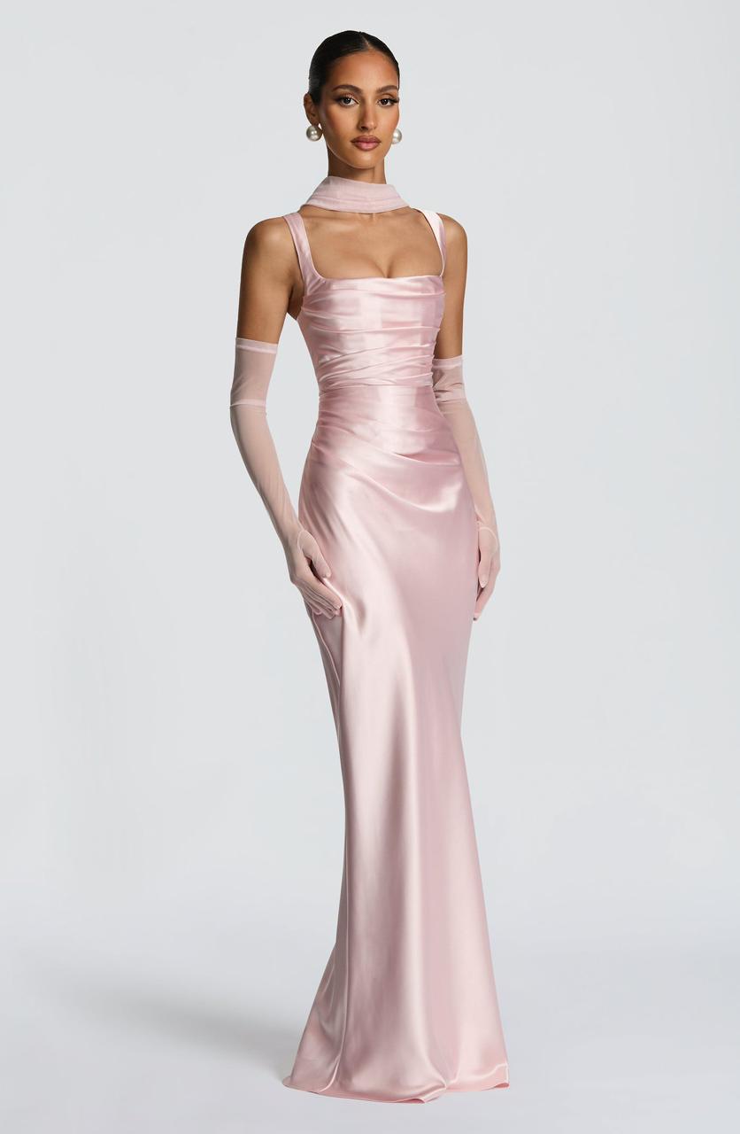Side profile of the Calanthe Maxi Dress highlighting the asymmetric pleats on the bodice and the flowing maxi dress