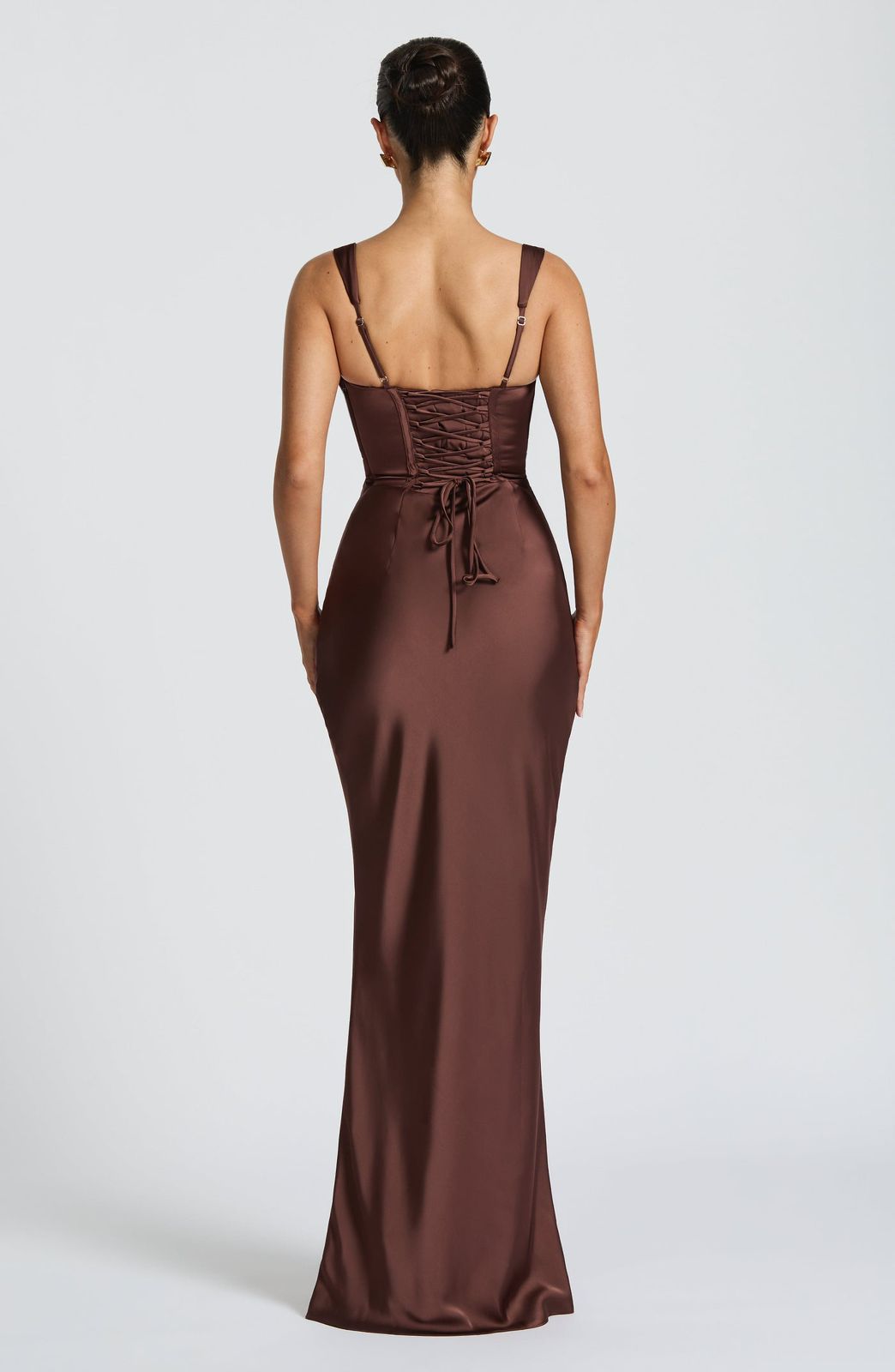 Close-up of the adjustable lace-up corset back on the Calanthe Maxi Dress, showing the elegant tie detail and tailored fit