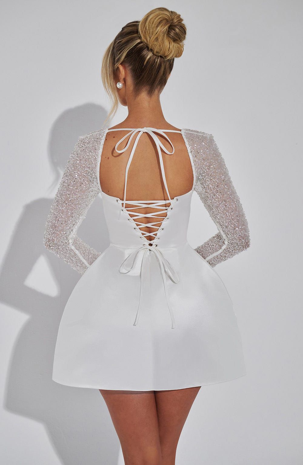 Back view of Dolly mini dress by Qorsage featuring elegant fit and modern party wear design