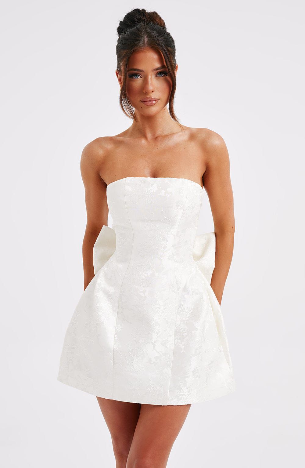 Elenora mini dress styled for party with strapless neckline and elegant silhouette