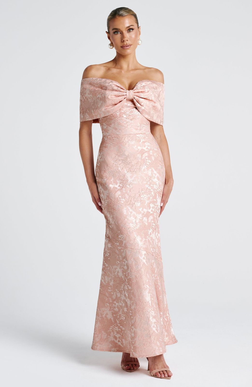 Emberly Maxi Dress in Ivory floral jacquard by Qorsage - A sophisticated off-the-shoulder gown with an oversized bardot bow neckline