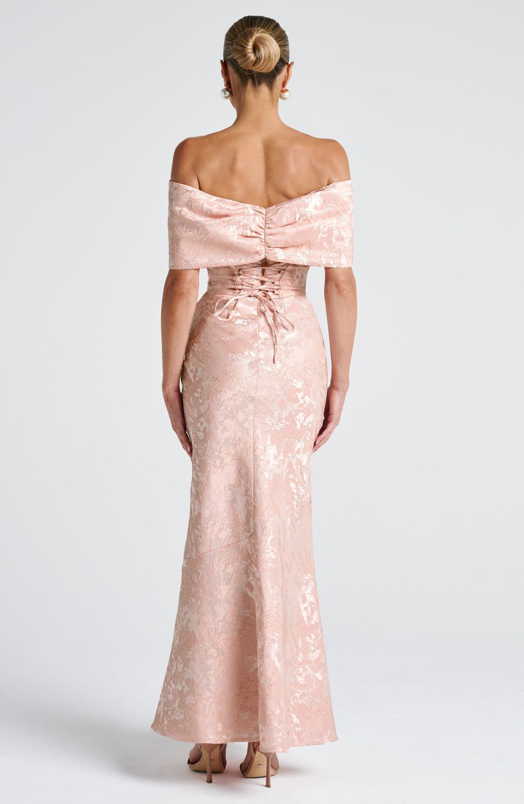 Back view of the Emberly Maxi Dress showing the elegant lace-up corset detail for a custom fit