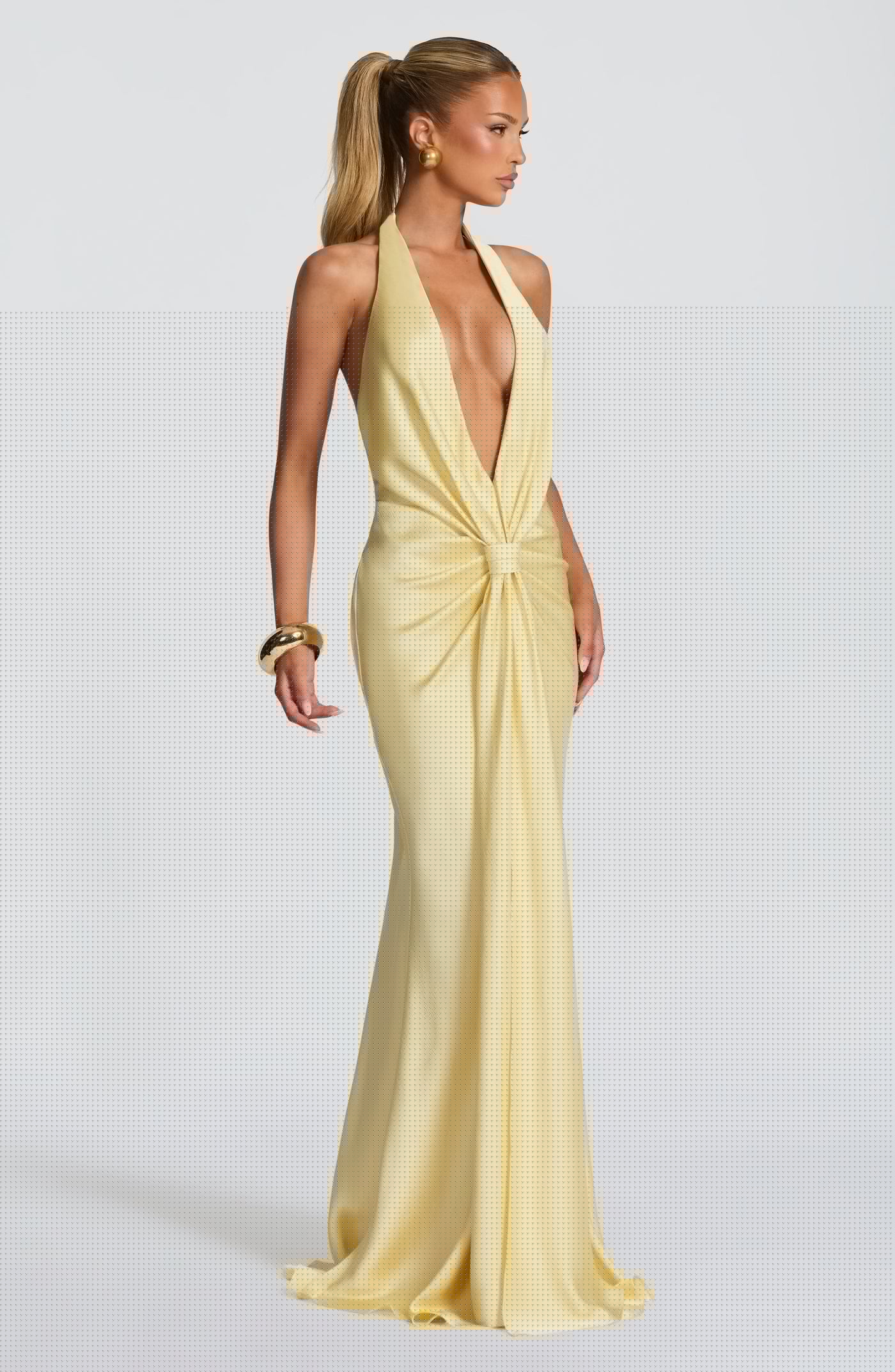 Side profile of the Linette Maxi Dress showcasing the cascading skirt and elegant silhouette.