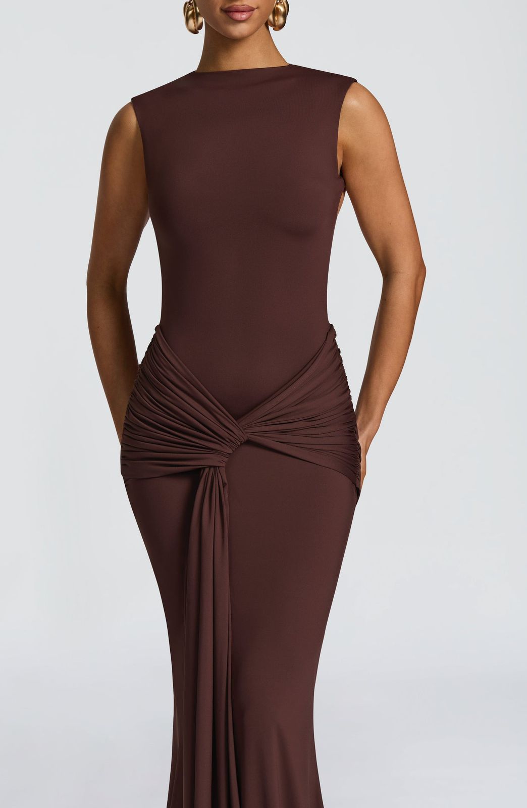 Close-up of the ruched knot detail and long drape tie at the waist of the Lorenza Maxi Dress