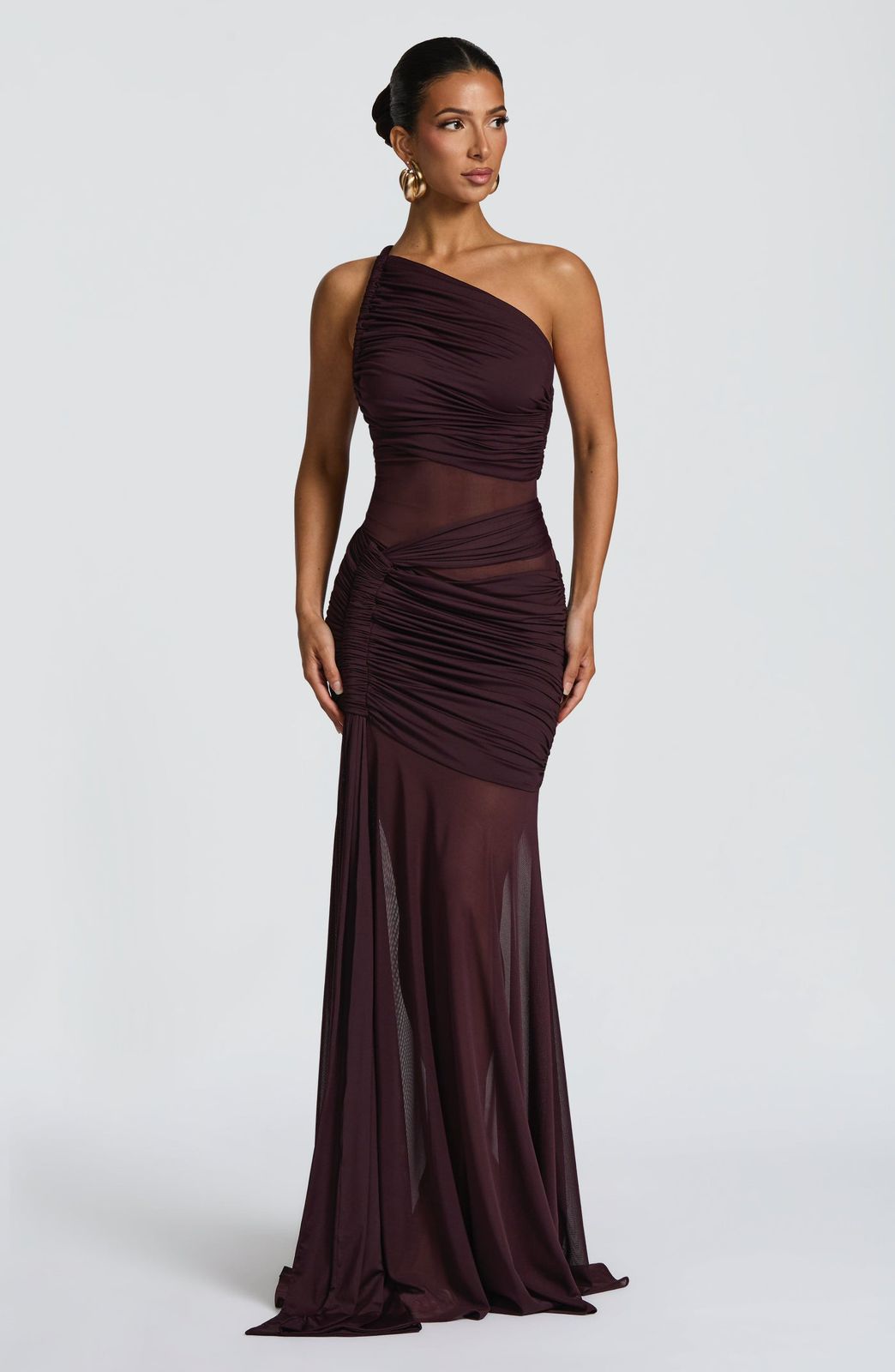 Side profile of the Marianne Maxi Dress highlighting the functional channel detail and long drape panel