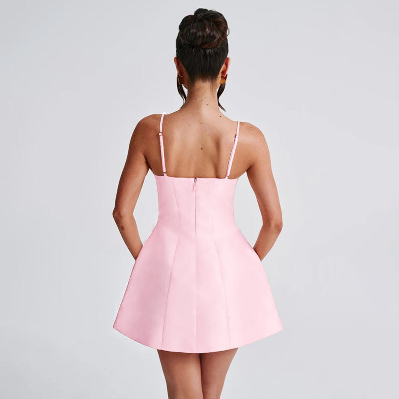 Back view of the Nicole Mini Dress showing zipper detail and elegant fit