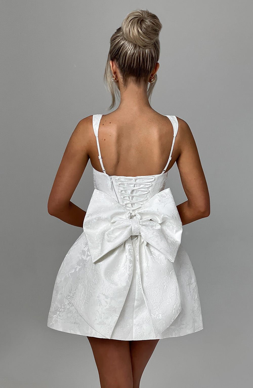 Back view of Orla mini dress with sleek silhouette and flattering mini dress design for women